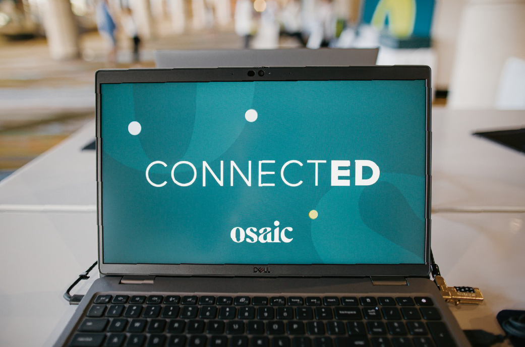 A black laptop with 'Osaic ConnectED' on the screen